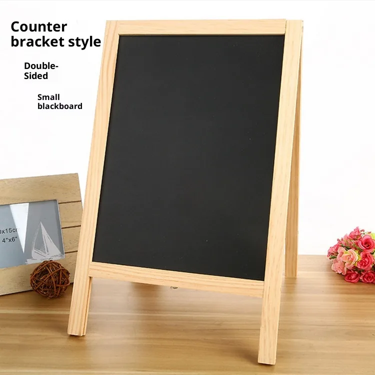 Wooden blackboard easel with chalk writing on blackboard panel