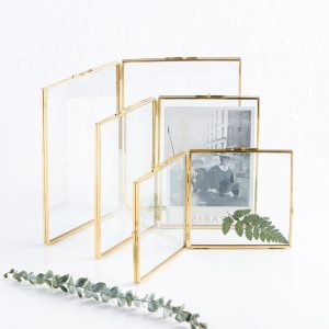 Copper glass folding frame with dual clear glass panels on white background