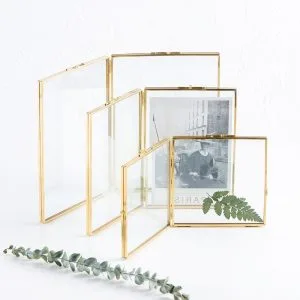Copper glass folding frame with dual clear glass panels on white background