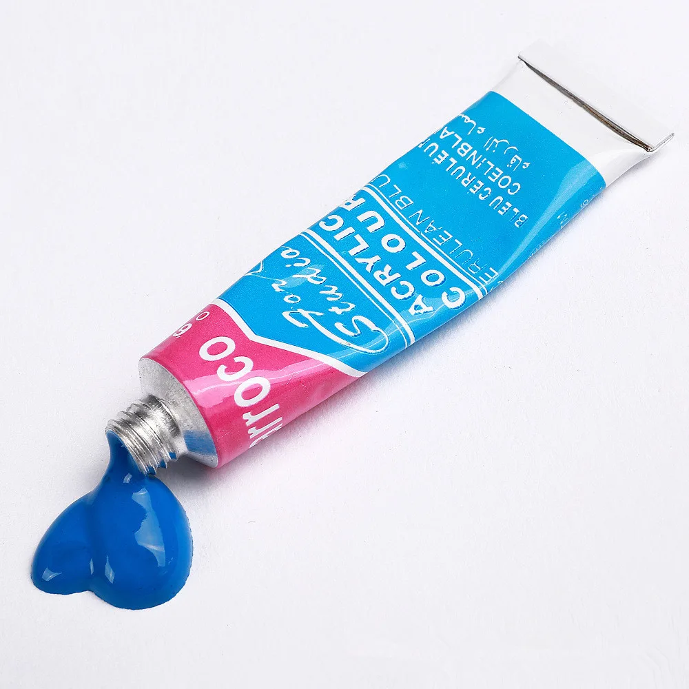 Blue acrylic paint tube from acrylic paint set with brush with paint squeezed out