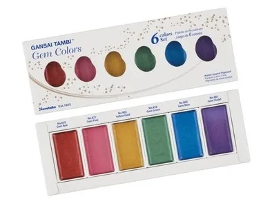 Starry Gem watercolour paint set with six vibrant jewel-tone colours in a rectangular palette with colour swatches displayed on the lid