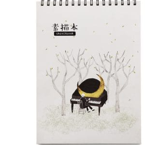 Illustrated sketchbook with misty forest and piano cover artwork
