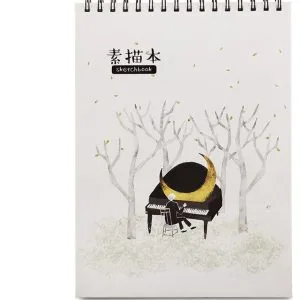 Illustrated sketchbook with misty forest and piano cover artwork