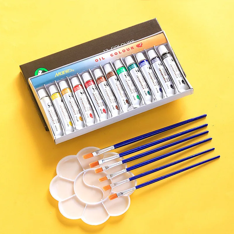 Beginner oil paint set in use on canvas with oil paints and brush