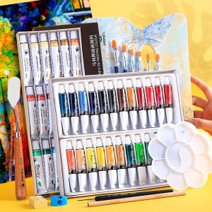 Beginner oil paint set in use on canvas with oil paints and brush