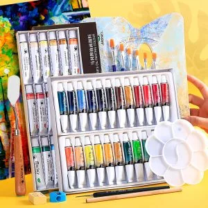 Beginner oil paint set in use on canvas with oil paints and brush