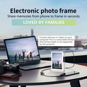 Digital electronic photo frame on desk displaying photo slideshow