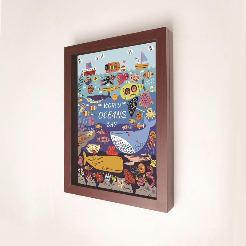 A4 magnetic shadow frame in rosewood finish on wall