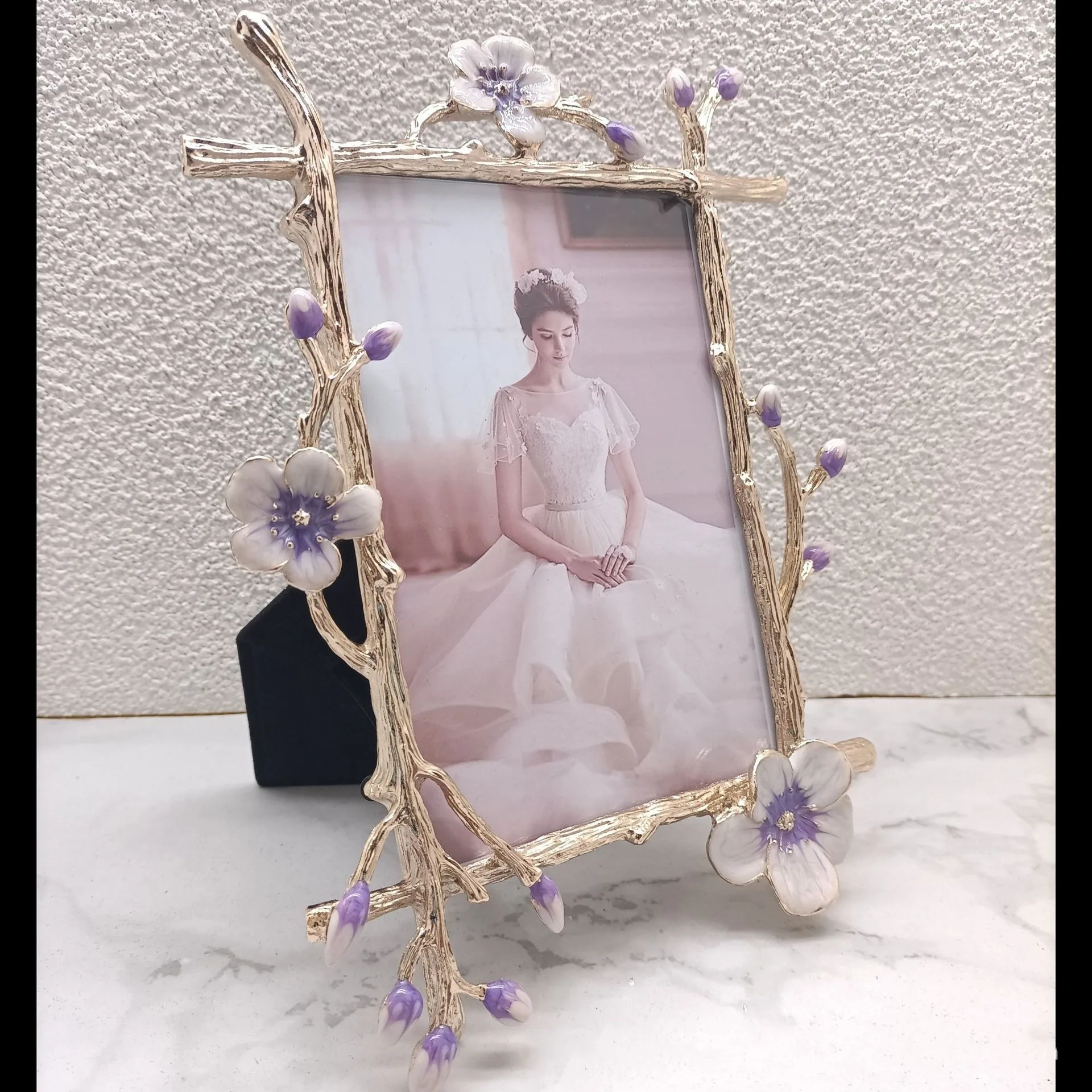 Gold metal ornate photo frame – angled side profile view