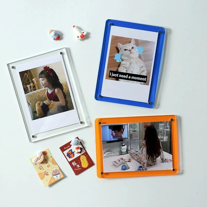 Magnetic acrylic photo frame displaying print on desk in modern interior