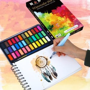 Solid watercolour paint set in use outdoors for travel sketching