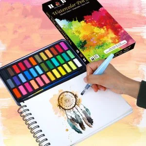 Solid watercolour paint set in use outdoors for travel sketching