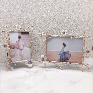 European style gold photo frame with ornate floral branch detailing
