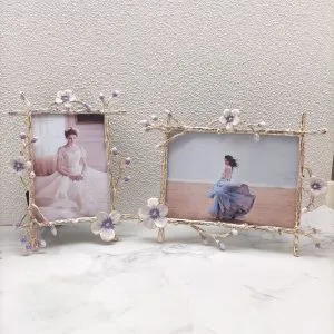 European style gold photo frame with ornate floral branch detailing