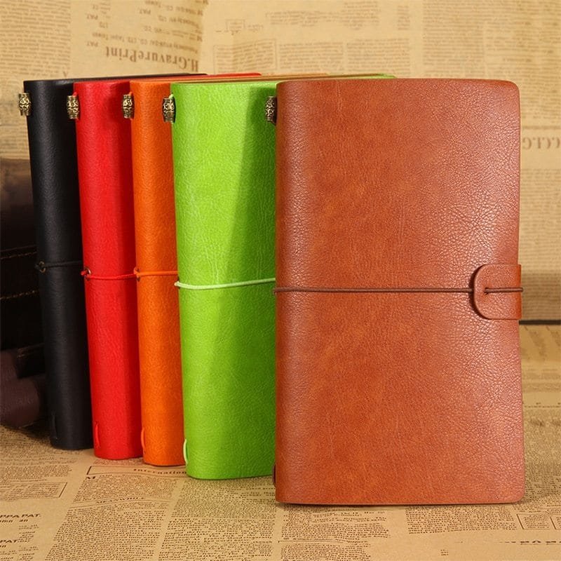 Vintage travellers notebook in PU leather showing five colour options A6