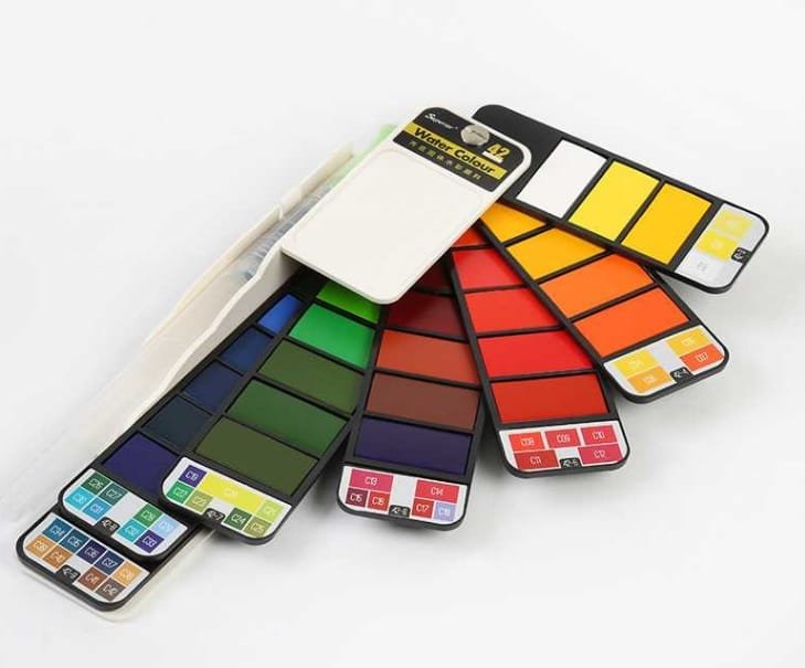 Close up detail of watercolour paint cake colours in foldable set