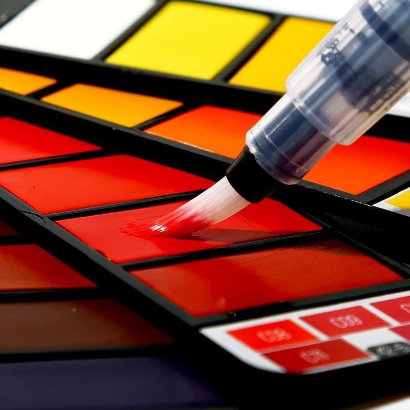 Travel watercolour paint cakes fanned out showing full colour range